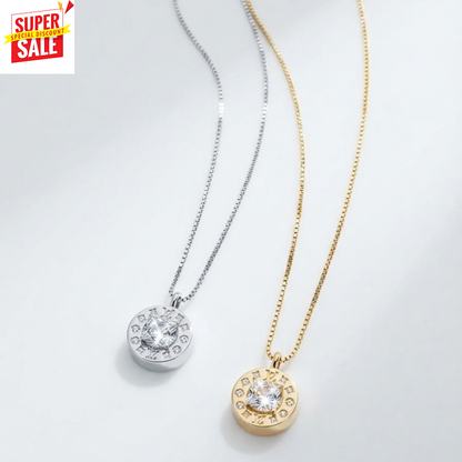 Two round pendant necklaces on delicate chains, one silver-toned and one gold-toned, each featuring a central clear gemstone surrounded by small inset stones. A red and yellow 'SUPER SALE' badge appears in the top-left corner.