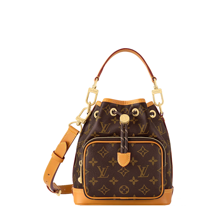 monogram canvas bucket bag with tan leather trim, gold-tone hardware, a top handle, and an adjustable shoulder strap, shown on a plain white background.