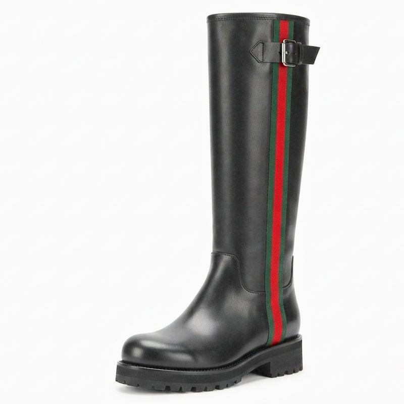 A single black leather knee-high boot with a signature vertical green and red stripe down the side and a buckle strap near the top, shown on a plain white background.