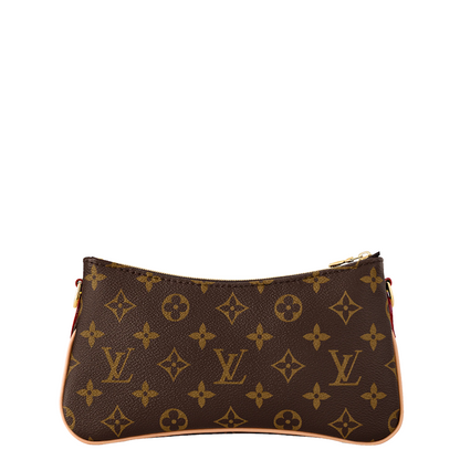 monogram canvas pouch in dark brown with gold-tone hardware, shown against a plain white background.