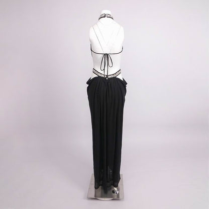 A black pleated maxi skirt with a sheer black mesh overlay and lace trim at the hem, displayed on a white mannequin torso against a light gray studio background.