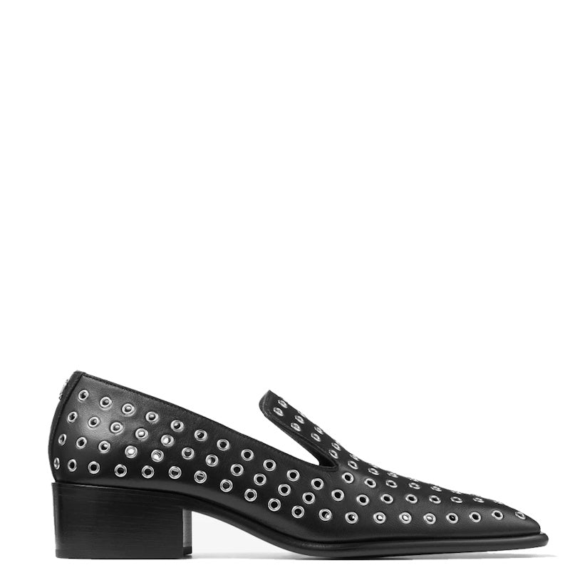 A single black leather Mary Jane shoe with silver-tone metal eyelet studs, shown in a side profile on a plain white background.