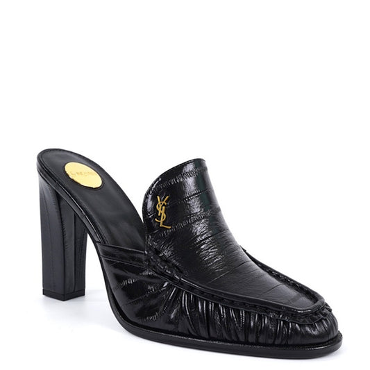 A black leather high-heeled mule slipper with a textured crocodile-embossed pattern, featuring a gold-tone Y logo on the side and a gold insole label, shown against a plain white background.