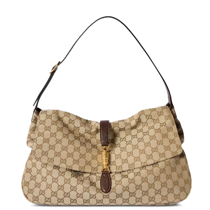A beige and brown GG Supreme canvas shoulder bag with a dark brown leather strap and a gold-tone turn-lock clasp on a white background.