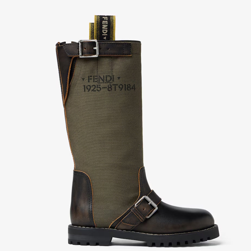 A Fen tall riding boot in olive green canvas and dark brown leather, featuring a black printed serial number and the Fendi logo on the side, with a yellow Fendi pull tab visible at the top.