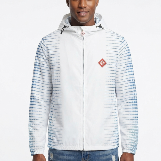 A man wearing a white hooded windbreaker jacket with blue tie-dye style horizontal stripes on the sleeves and sides, featuring a small red diamond-shaped logo patch on the left chest.