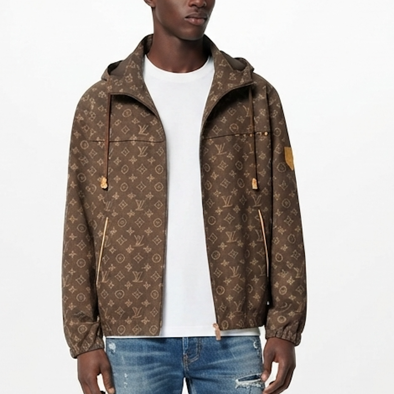 A man wearing a brown L monogram hooded jacket over a white t-shirt and blue jeans, shown from the waist up against a plain white background.