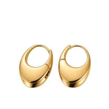 A pair of polished gold crescent-shaped hoop earrings on a solid white background.