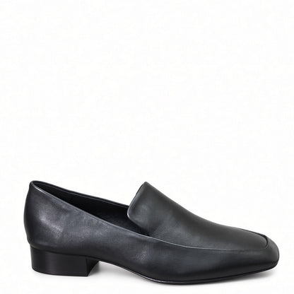 A single black leather slip-on loafer with a low block heel, shown in a side profile on a plain white background.