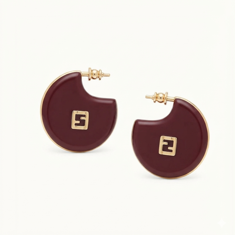 A pair of gold-tone Fendi crescent-shaped hoop earrings with a deep burgundy enamel center and the signature FF logo, shown on a clean off-white background.