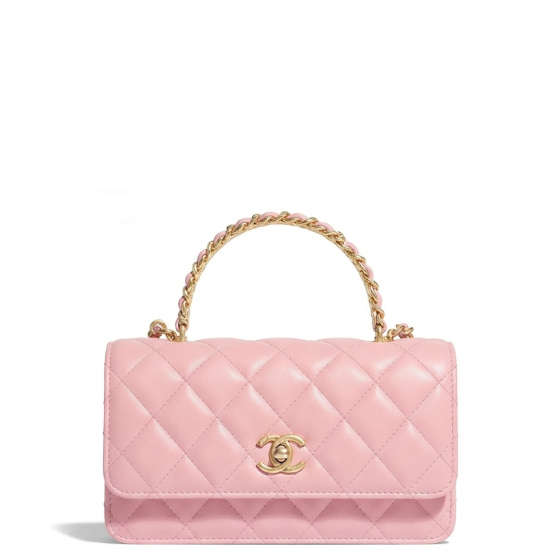 A pink quilted leather top-handle handbag with a gold-tone interwoven handle, a gold-tone interlocking CC logo clasp, and a gold chain detail, shown on a plain white background.