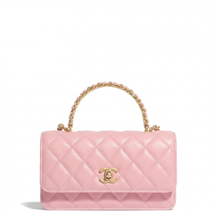 A pink quilted leather top-handle handbag with a gold-tone interwoven handle, a gold-tone interlocking CC logo clasp, and a gold chain detail, shown on a plain white background.