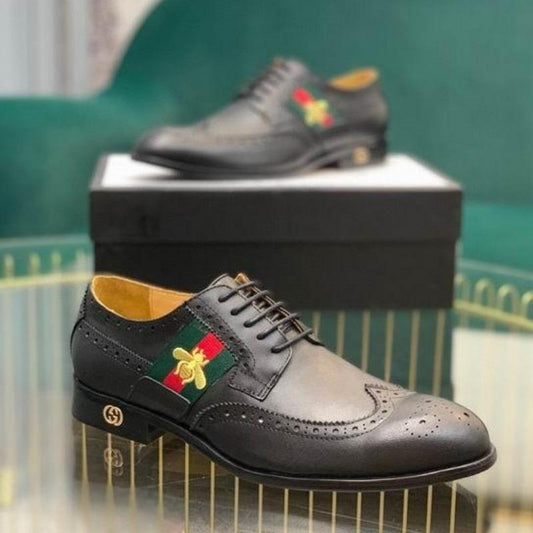 GU Shoes Man Logo