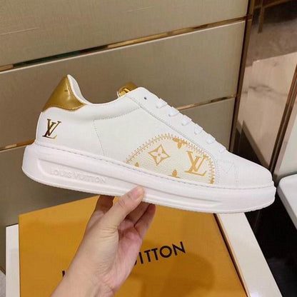 LU Sneakers Gold