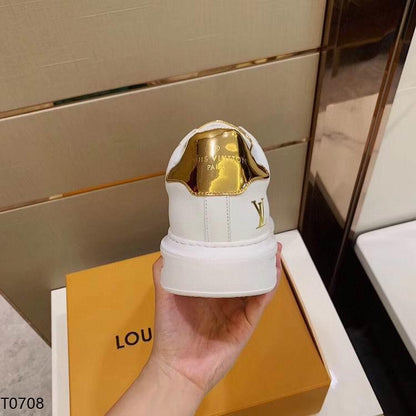 LU Sneakers Gold